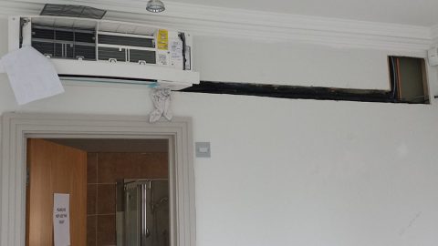 Daikin Emura wall mounted system with pipework run in the wall.