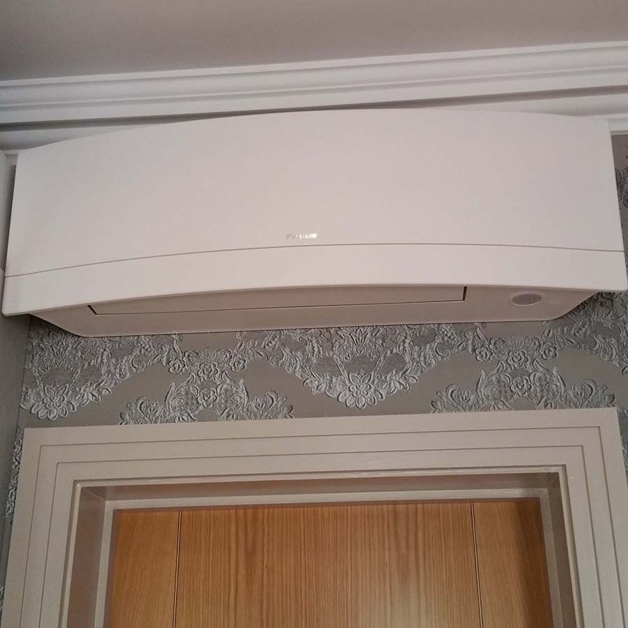 Daikin Emura wall mounted system with pipework hidden in the wall.