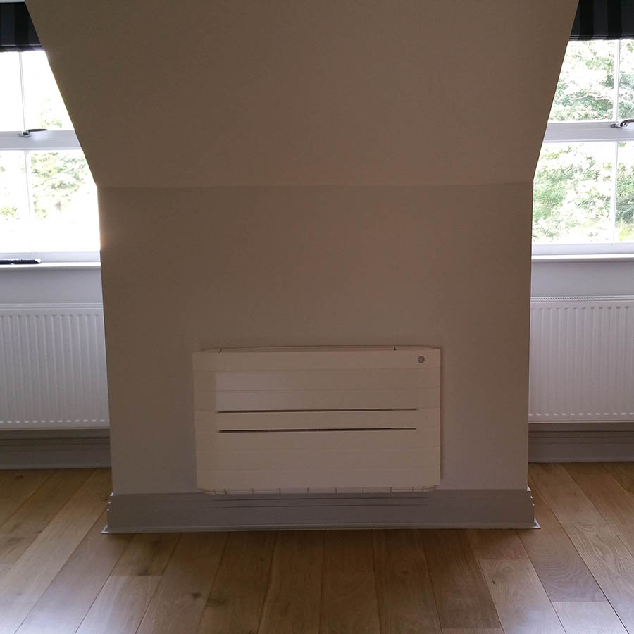 Daikin Nexura floor mounted units semi recessed in a loft conversion supplying both heating and cooling.