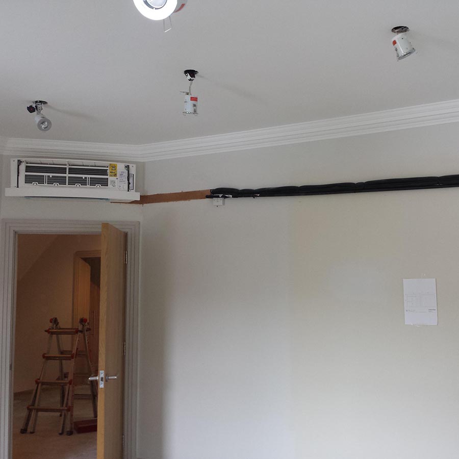 Daikin Emura wall mounted system with pipework hidden in the wall.
